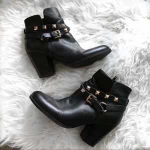 Edgy black booties with gold studs